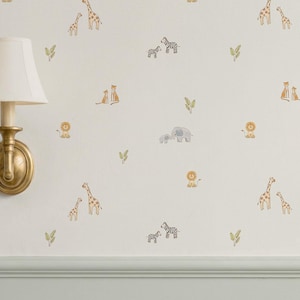 May include: A cream-coloured wall adorned with safari animal decals. The design features giraffes, lions, zebras, and elephants in a soft watercolour style. Scattered green leaf decals complement the animal illustrations.