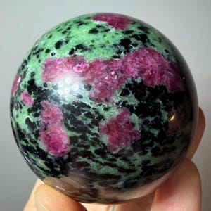 Ruby in Zoisite Sphere UV Reactive Ruby Tanzania Polished Gemstone with Stand
