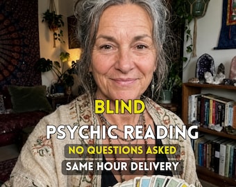 May include: A person holding a fan of tarot cards, wearing a beige patterned cardigan over a black top. Text overlay reads: BLIND PSYCHIC READING, NO QUESTIONS ASKED, SAME HOUR DELIVERY. The person has grey hair and layered necklaces.