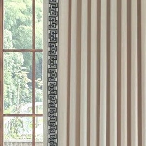 May include: White curtains with a black geometric pattern border. The curtains are hanging in a window with a wooden frame.
