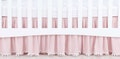 Pink Crib Skirt with Pom Poms or Tassels