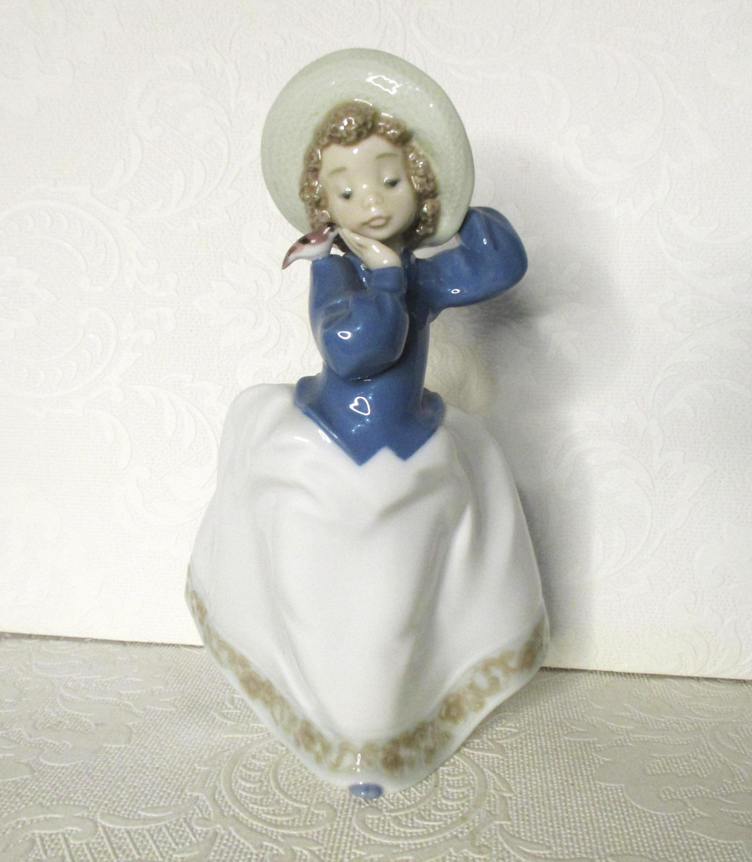 Vintage Daisa 1990 Lladro NAO Girl Wearing A Hat With A Bird on
