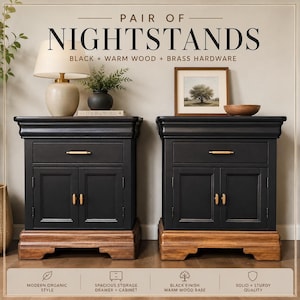 May include: A pair of black nightstands with warm wood bases and brass hardware. Each nightstand features a drawer and cabinet doors. The text on the image reads "PAIR OF NIGHTSTANDS BLACK + WARM WOOD + BRASS HARDWARE".