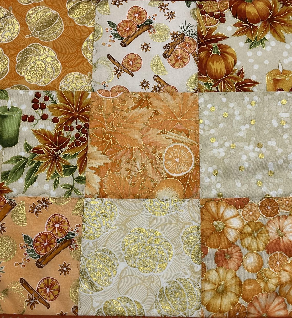 Pumpkin Latte Glow Quilted Table Topper NCU0NXD073
