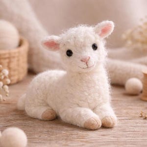 May include: A handcrafted white lamb figurine with a fluffy wool texture. The lamb has black eyes, pink ears, and a pink nose. It is lying down with its legs tucked beneath it. A charming decorative item.