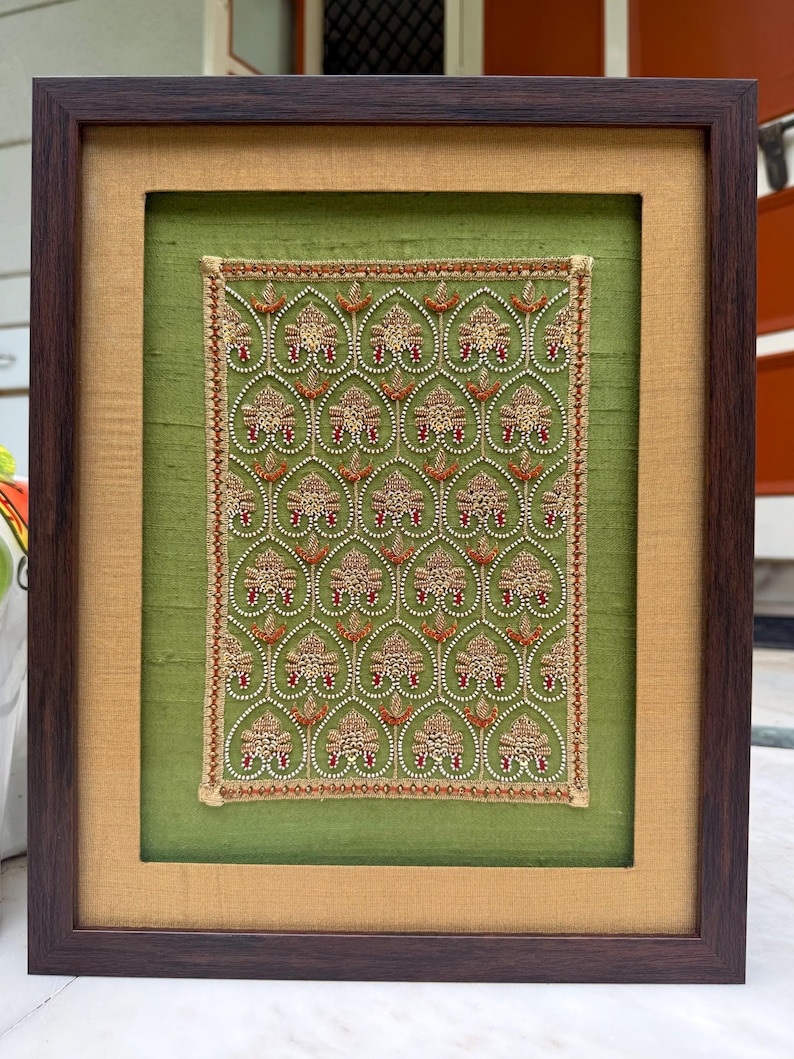 Front view of luxury framed textile art with green silk, gold border and heritage embroidery, perfect for anniversary, engagement or couple gifting.