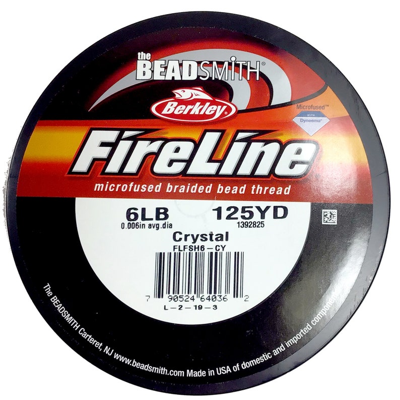 May include: A spool of black FireLine microfused braided bead thread fishing line. The spool is labeled with the brand name "Berkley", the product name "FireLine", the line size "6LB", the line length "125YD", and the line diameter "0.006in avg.dia". The spool also has a barcode and the text "Crystal FLFSH6-CY 1392825".