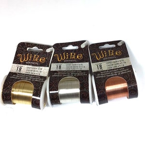 May include: Three spools of 18 gauge tarnish-resistant wire in gold, silver, and copper colors. Each spool is labeled "Wire elements" and includes the color and length of the wire.