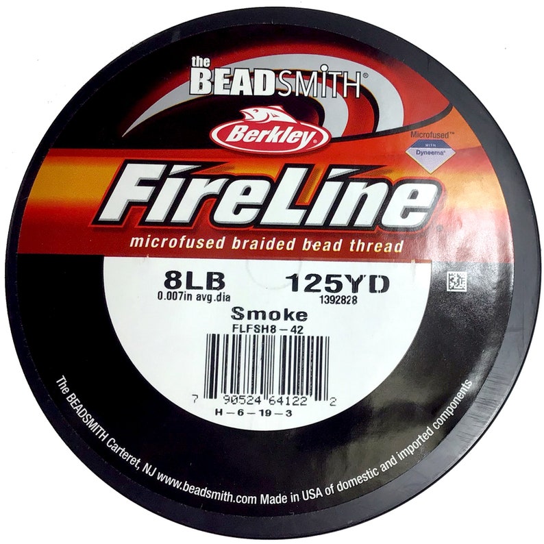 May include: A spool of 8lb FireLine microfused braided bead thread fishing line in smoke color. The spool is black with red and white text and a barcode. The text on the spool reads "FireLine", "microfused braided bead thread", "8LB", "0.007in avg.dia", "Smoke", "FLFSH8-42", "125YD", "1392828", "The BEADSMITH Carteret, NJ www.beadsmith.com Made in USA of domestic and imported components".