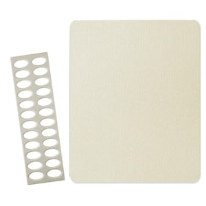 May include: A rectangular, off-white textured pad with rounded corners is positioned next to a long, thin, gray plastic strip with 18 oval cutouts. The pad and strip are on a white background.