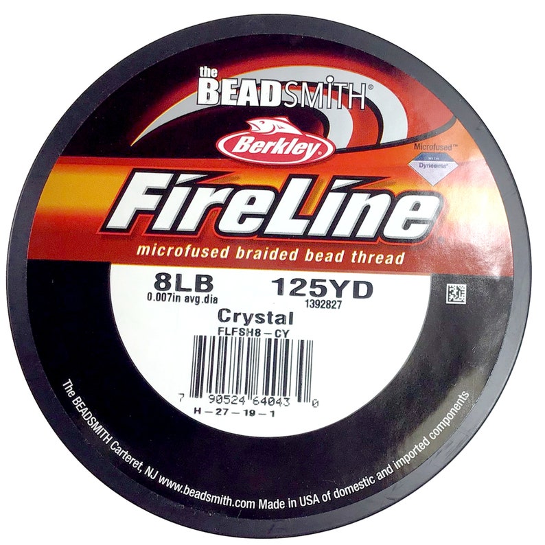 May include: A spool of 8lb FireLine Crystal microfused braided bead thread fishing line in a black and red container. The spool is labeled with the brand name "Berkley" and the text "125YD 1392827".
