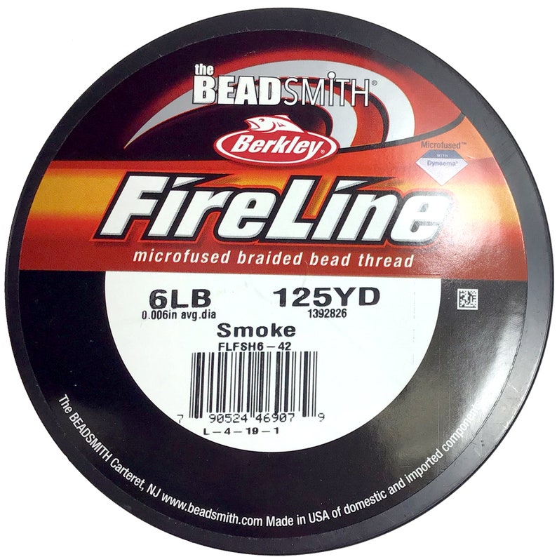 May include: A spool of black FireLine microfused braided bead thread fishing line. The spool is labeled with the brand name "Berkley FireLine", the line weight "6LB", the line diameter "0.006in avg.dia", the line length "125YD", and the product code "1392826". The spool also has a barcode and the text "Smoke FLFSH6-42".