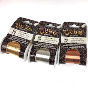 May include: Three spools of 20 gauge tarnish-resistant wire in gold, silver, and copper colors. Each spool is labeled "Wire elements" and includes the color, length in yards and meters, and gauge.