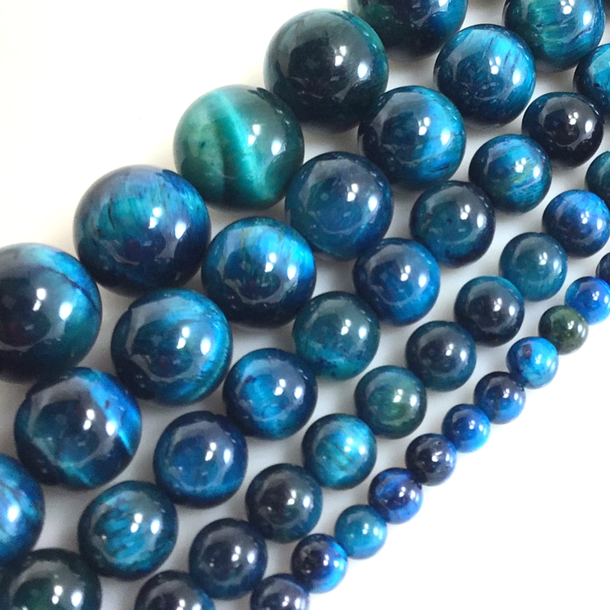 Bead, tigereye (natural), 8mm round, B grade, Mohs hardness 7. Sold per  15-1/2 to 16 strand. - Fire Mountain Gems and Beads