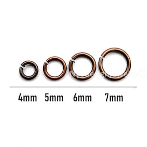 May include: Four copper-colored jump rings in varying sizes: 4mm, 5mm, 6mm, and 7mm. The rings are open, ready for use in jewelry making or crafts. The sizes are labeled in black text below the rings.