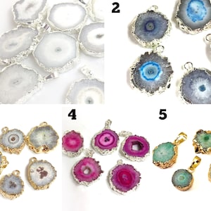 May include: Assortment of agate pendant charms with gold and silver accents. The pendants are various shapes and sizes, with different colors and patterns.