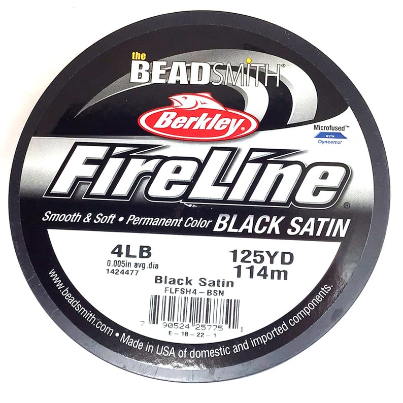 May include: A spool of black Berkley FireLine fishing line with the text "Black Satin" and "Microfused" with Dyneema. The spool is labeled 4lb, 0.005in avg. dia, 1424477, 125yd, 114m, and FLFSH4-BSN.
