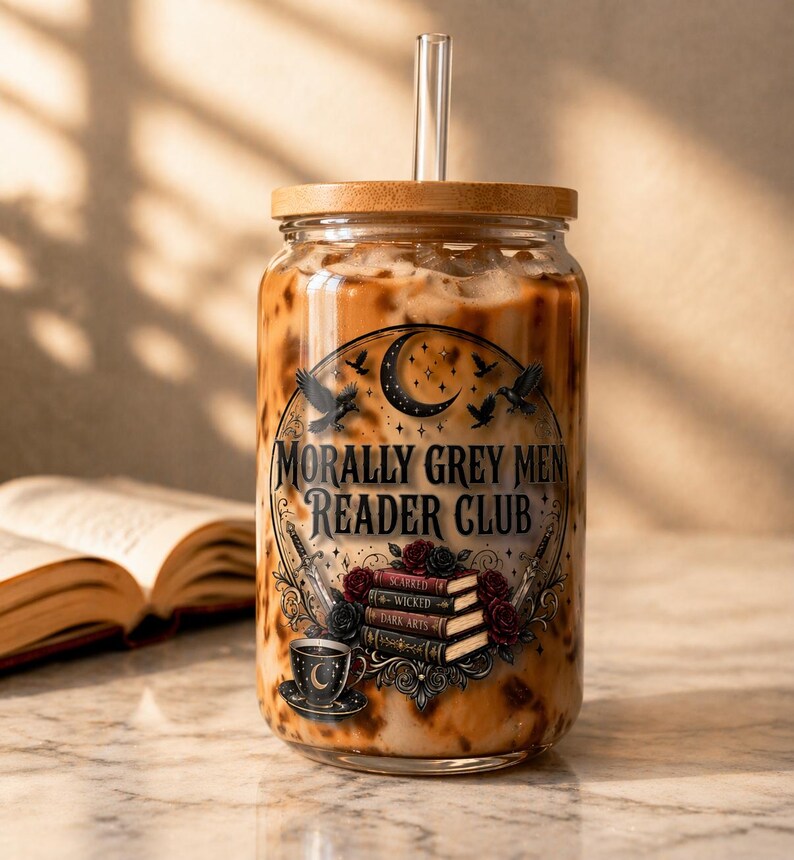 Glass tumbler with "Morally Grey Men Reader Club" text and book and sword imagery.