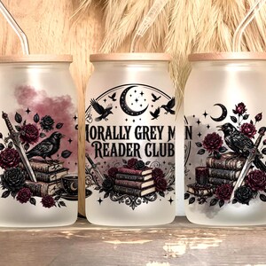 Three frosted glass tumblers with spooky book and raven designs.