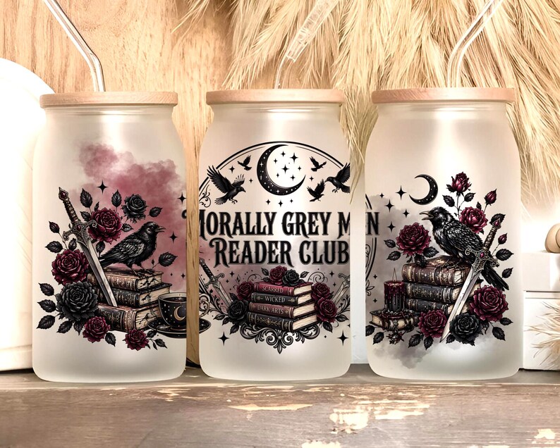 Three frosted glass tumblers with spooky book and raven designs.