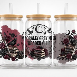 Three clear tumblers with dark, gothic-inspired designs and text.