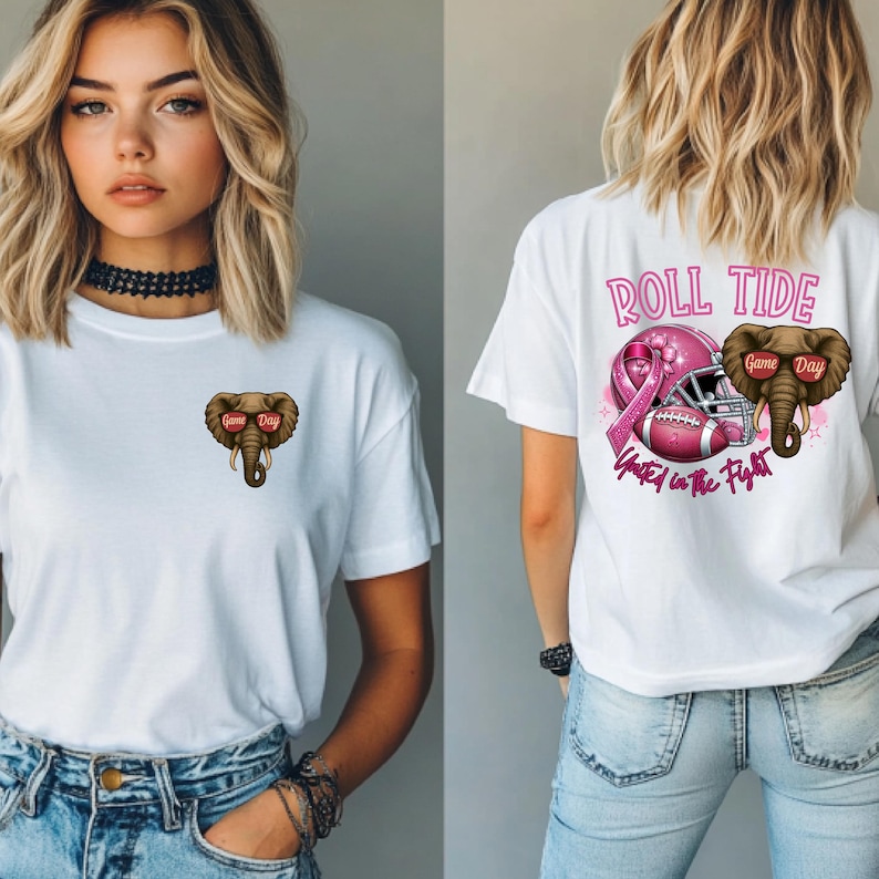 May include: White t-shirt featuring a brown elephant wearing sunglasses with the text "Game Day". The back of the shirt has the words "Roll Tide" above a pink football helmet and ribbon, with the text "United in the Fight".