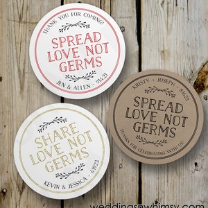 Puede incluir: Dos pegatinas redondas para favores de boda con el texto "Spread Love Not Germs" y un diseño floral. Una pegatina es blanca con texto dorado y la otra es marrón con texto negro. La pegatina blanca tiene el texto "Share Love Not Germs" y los nombres "Kevin & Jessica" y la fecha "6.19.23". La pegatina marrón tiene el texto "Spread Love Not Germs" y los nombres "Kristy + Joseph" y la fecha "8.16.23".