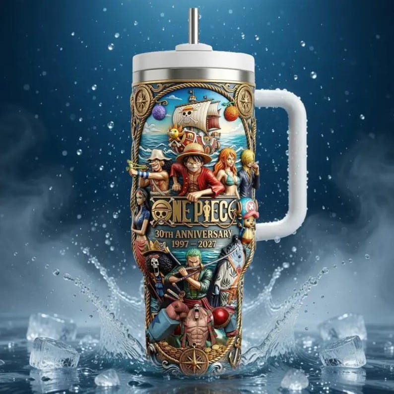 May include: A stainless steel tumbler with a white handle and lid, featuring a colorful illustration of characters and a ship from the "One Piece" anime series. The design includes the text "ONE PIECE 30TH ANNIVERSARY 1997-2027".