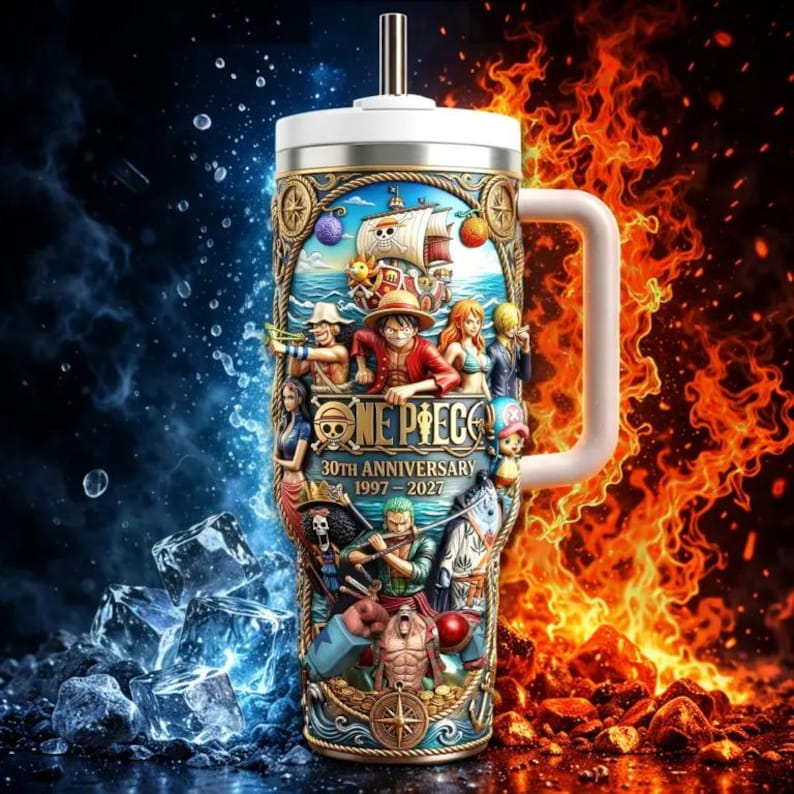 May include: A stainless steel tumbler with a white handle and lid, featuring a colorful illustration of One Piece characters and a ship on the ocean. The text "ONE PIECE 30TH ANNIVERSARY 1997-2027" is displayed on the tumbler.