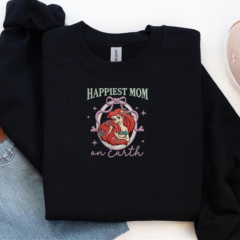 May include: A set of three ceramic mugs with a speckled, matte finish. Each mug features a different color: light blue, cream, and gray. The mugs have a simple, modern design with a rounded shape and a comfortable handle.