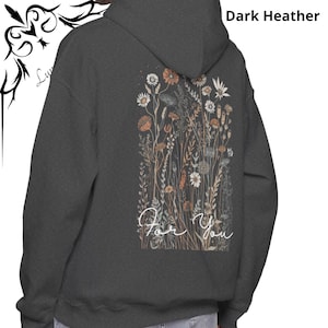 May include: Dark heather gray hoodie with a floral design on the back. The design features various flowers in shades of orange, white, and brown, with the words "For You" in a cursive font. The hoodie has a hood and a simple design.