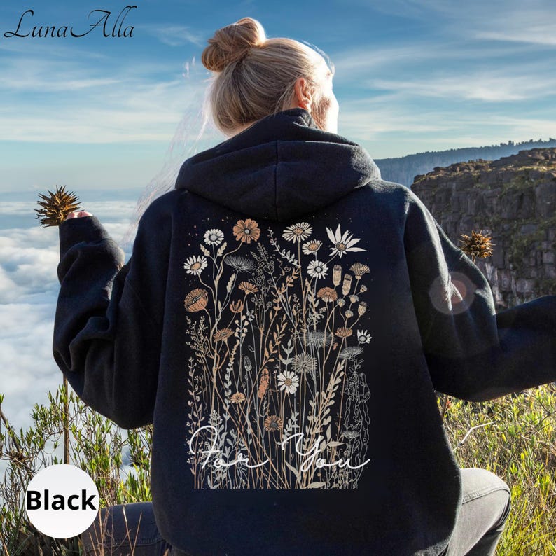 May include: Black hoodie with a floral design on the back. The design features various flowers and foliage in shades of white, beige, and brown. The words "For You" are written in cursive script below the floral arrangement. The hoodie is labeled "Black" at the bottom.