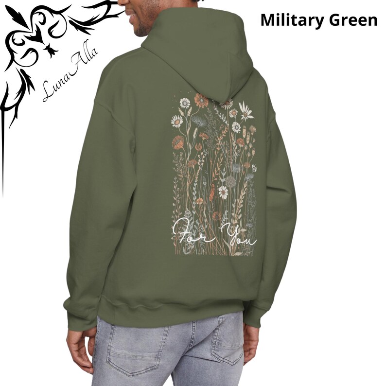 May include: Military green hoodie with a floral design on the back, featuring wildflowers in shades of orange, beige, and white. The words "For You" are written in a cursive font below the flowers. The hoodie has a hood and long sleeves.