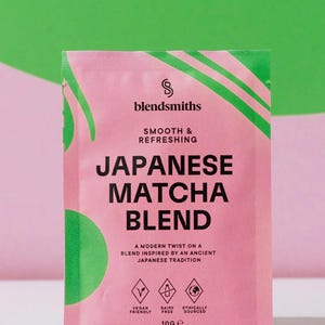 May include: A pink packet of Japanese Matcha Blend by blendsmiths, with green accents. The text on the packet reads "Smooth & Refreshing" and "A modern twist on a blend inspired by an ancient Japanese tradition." The packet is vegan friendly, dairy free, and ethically sourced.