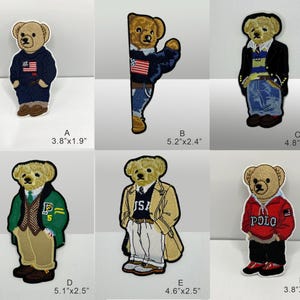 May include: Six embroidered bear patches labeled A through F with dimensions ranging from 3.8 by 1.8 inches to 5.2 by 2.4 inches. Each patch depicts a tan teddy bear dressed in various outfits including sweaters, jackets, and jeans with USA flag details.