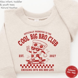 May include: A natural heather crewneck sweatshirt featuring a red graphic of a pizza slice on a skateboard wearing sunglasses and making a peace sign. The text reads OFFICIALLY PROMOTED TO THE COOL BIG BRO CLUB EST. 2027 CRUISING INTO BIG BRO LIFE.