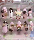 3D Rila.kkuma Press On Nails: Kawaii Chocolate Dessert Art product logo
