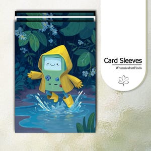 May include: A stack of card sleeves featuring a light green rectangular character with a smiling face, wearing a yellow raincoat and yellow boots, jumping into a blue puddle. The background shows dark green foliage and blue flowers in the rain.