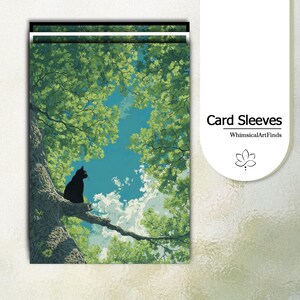 May include: Card sleeves featuring a serene illustration of a black cat perched on a tree branch, set against a backdrop of lush green foliage and a blue sky with clouds. The text "Card Sleeves" and the shop name "WhimsicalArtFinds" are visible.
