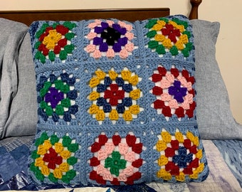 Granny square pillow with retro design