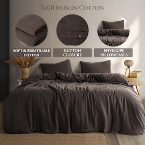 May include: A dark brown muslin cotton bedding set. The set includes a duvet cover and two pillowcases. The duvet cover has a button closure. The image also shows the text: "Soft & Breathable Cotton", "Button Closure", and "Envelope Pillowcases".