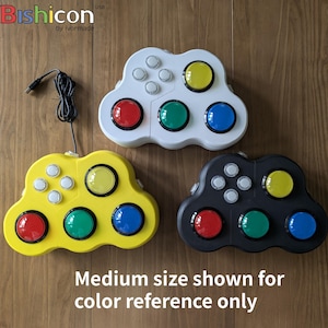 May include: Three colorful game controllers in white, yellow, and black, each with a USB cable. The controllers have red, green, blue, and yellow buttons. The text reads "Medium size shown for color reference only."