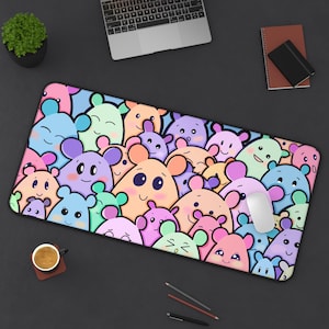 May include: A rectangular mousepad featuring a colorful pattern of cartoon mice in various pastel colors. The design includes shades of pink, blue, green, and orange, with smiling faces. A white mouse is on the right side of the mousepad.