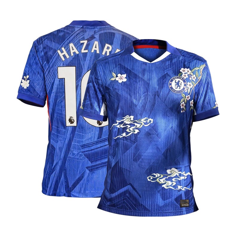 May include: A blue Chelsea football shirt with "HAZAR" and the number "10" on the back. The shirt has white floral and cloud patterns, and the Chelsea team emblem is on the front.