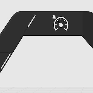 May include: A black, angular bracket featuring a gauge icon and directional arrows. The bracket has two holes on the vertical section and angled sections with white lines. The gauge icon has a needle pointing to the left.