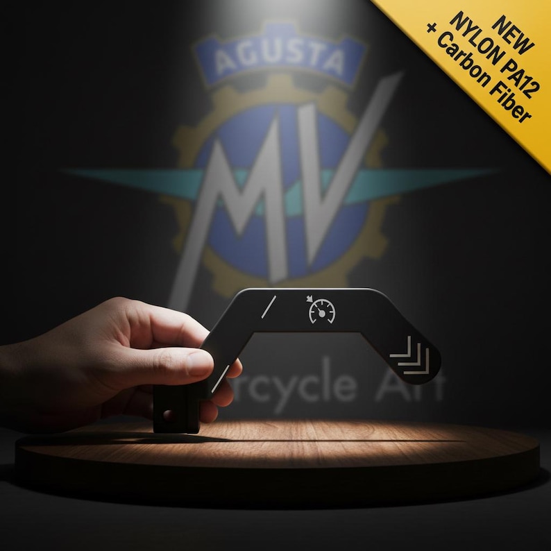 May include: A black motorcycle accessory made from Nylon PA12 and carbon fibre. The curved accessory features white graphic elements, including a speedometer icon and directional arrows. The background shows a logo and the text "Cycle Art."