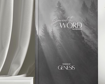 May include: A hardcover journal with a grayscale forest scene on the cover. The text "Journal the WORD" is in a script font, with "OLD TESTAMENT" below. "THE BOOK OF GENESIS" is at the bottom.
