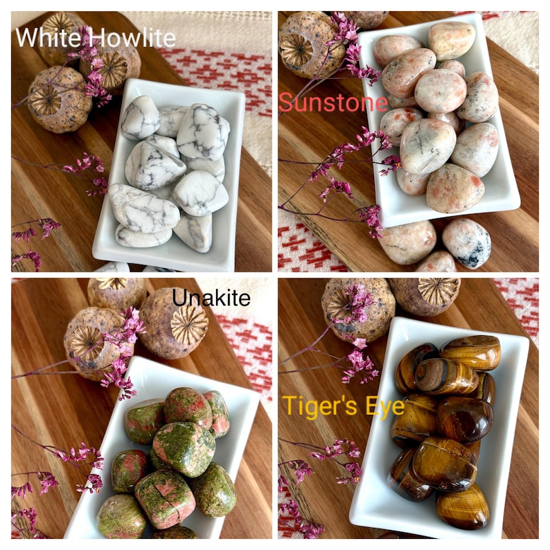 May include: Four square images showcasing different types of polished gemstones. The top left displays White Howlite, the top right Sunstone, the bottom left Unakite, and the bottom right Tiger's Eye. Each type is in a white rectangular dish on a wooden surface.