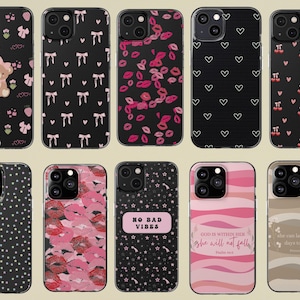 May include: Collection of phone cases with various designs. Patterns include bows, hearts, lips, cherries, polka dots, and text. Colors are black, pink, and white. Some cases feature text like "NO BAD VIBES" and Bible verses.