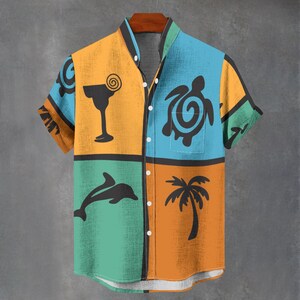 May include: Short-sleeved button-down shirt with a tropical theme. The shirt features a patchwork design with orange, teal, and blue panels. Each panel has a black graphic of a cocktail, turtle, dolphin, and palm tree.